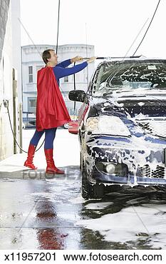 Stock Photography - man in superhero 
costume washing 
car at car wash, 
side view. fotosearch 
- search stock 
photos, pictures, 
images, and photo 
clipart