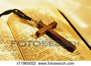 Stock Photo - wooden crucifix 
on open bible. 
fotosearch - search 
stock photos, 
pictures, images, 
and photo clipart