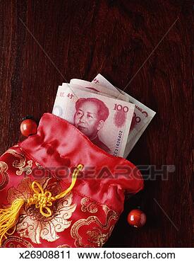Stock Photography - chinese currency; 
open silk purse 
with chinese banknotes. 
fotosearch - search 
stock photos, 
pictures, images, 
and photo clipart
