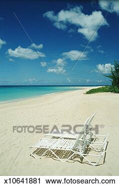 Stock Photography - west indies, barbados, 
two sunloungers 
on sandy beach. 
fotosearch - search 
stock photos, 
pictures, images, 
and photo clipart