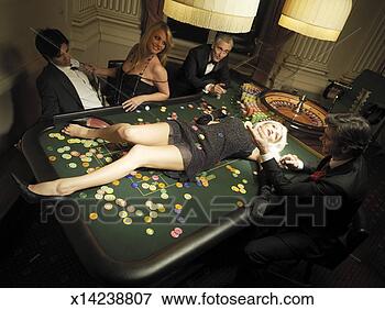 Picture - woman lying on 
table by roulette 
wheel, croupier, 
and gamblers. 
fotosearch - search 
stock photos, 
pictures, images, 
and photo clipart
