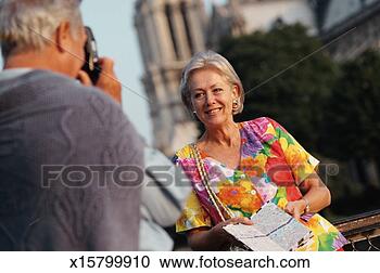 Stock Photography - mature man photographing 
mature female 
tourist. fotosearch 
- search stock 
photos, pictures, 
images, and photo 
clipart