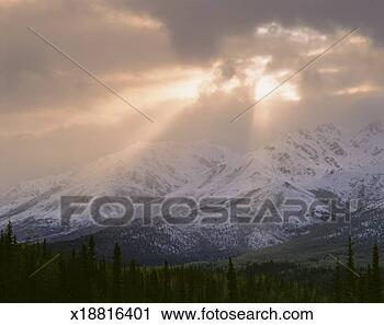 Stock Photography - usa, alaska, denali 
national park, 
sun breaks through 
storm clouds. 
fotosearch - search 
stock photos, 
pictures, images, 
and photo clipart