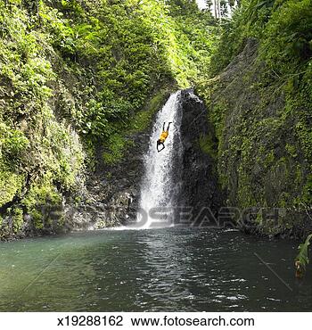 Stock Photo - man diving from 
waterfall. fotosearch 
- search stock 
photos, pictures, 
images, and photo 
clipart