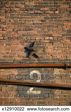 Stock Photo - pipes, star shape 
and number 2 sign 
on brick wall. 
fotosearch - search 
stock photos, 
pictures, images, 
and photo clipart