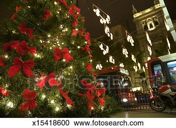 Stock Photography - spain, madrid, 
traffic passing 
christmas tree 
in street. fotosearch 
- search stock 
photos, pictures, 
images, and photo 
clipart