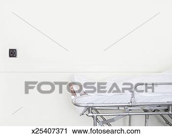 Stock Photography - body on stretcher 
in hallway, toe 
tag tied to toe. 
fotosearch - search 
stock photos, 
pictures, images, 
and photo clipart