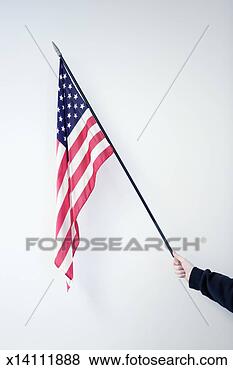 Stock Photo - boy (8-10) holding 
american flag 
(focus on flag). 
fotosearch - search 
stock photos, 
pictures, images, 
and photo clipart