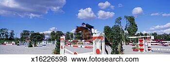 Stock Photo - horse and rider 
competing in show 
jumping event 
(blurred motion). 
fotosearch - search 
stock photos, 
pictures, images, 
and photo clipart