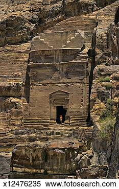 Stock Image - jordan, petra, 
mature man standing 
in doorway of 
palace tomb. fotosearch 
- search stock 
photos, pictures, 
images, and photo 
clipart