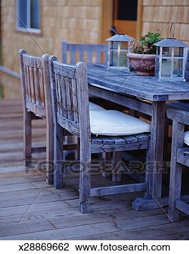 Stock Photo - teak dining table 
and chairs on 
deck (focus on 
chair in foreground). 
fotosearch - search 
stock photos, 
pictures, images, 
and photo clipart
