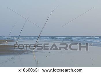 Stock Photography - france, le porge 
beach, three fishing 
rods on beach, 
outdoors. fotosearch 
- search stock 
photos, pictures, 
images, and photo 
clipart