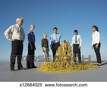 Stock Image - group of business 
people catching 
business woman 
in net on roof. 
fotosearch - search 
stock photos, 
pictures, images, 
and photo clipart