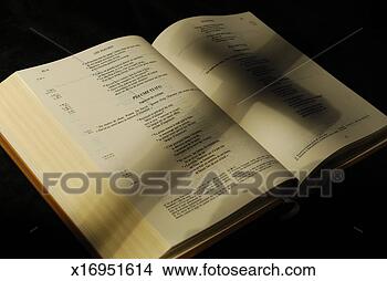 Stock Photo - crucifix shadow 
on french holy 
bible, close-up. 
fotosearch - search 
stock photos, 
pictures, images, 
and photo clipart