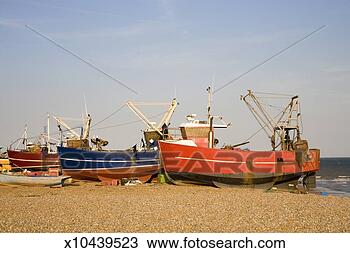 Stock Photo - england, east 
sussex, hastings, 
fishing boats 
on sandy beach. 
fotosearch - search 
stock photos, 
pictures, images, 
and photo clipart