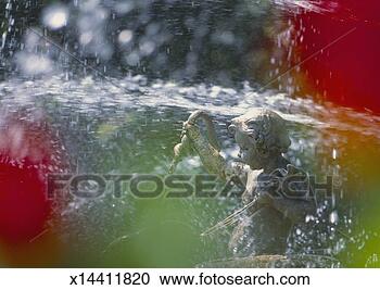 Stock Photography - fountain statue, 
close-up (blurred 
motion). fotosearch 
- search stock 
photos, pictures, 
images, and photo 
clipart