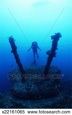 Stock Image - marshall islands, 
female diver exploring 
aircraft carrier. 
fotosearch - search 
stock photos, 
pictures, images, 
and photo clipart