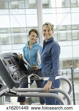Stock Photograph - woman with personal 
trainer in health 
club, portrait. 
fotosearch - search 
stock photos, 
pictures, images, 
and photo clipart