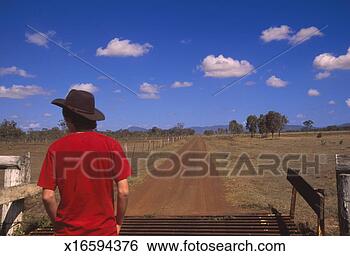 Stock Photo - australia, queensland, 
man looking at 
rural landscape, 
rear view. fotosearch 
- search stock 
photos, pictures, 
images, and photo 
clipart