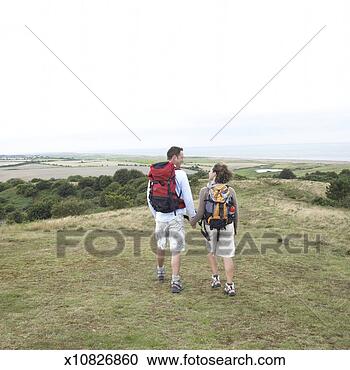 Stock Photography - couple hiking 
in countryside. 
fotosearch - search 
stock photos, 
pictures, images, 
and photo clipart
