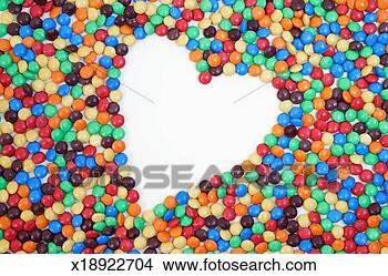 Stock Photo - empty heart shape 
space in between 
multicoloured 
candies. fotosearch 
- search stock 
photos, pictures, 
images, and photo 
clipart
