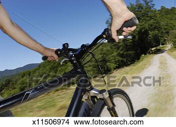 Stock Photo - man speeding on 
mountain bike 
(blurred motion). 
fotosearch - search 
stock photos, 
pictures, images, 
and photo clipart