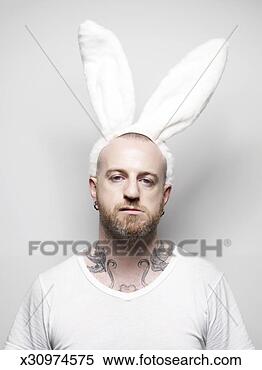 Stock Image - man wearing bunny 
ears, portrait. 
fotosearch - search 
stock photos, 
pictures, images, 
and photo clipart