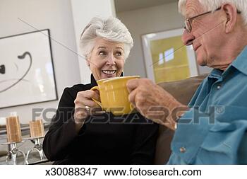 Picture - senior couple 
toasting coffee 
mugs. fotosearch 
- search stock 
photos, pictures, 
images, and photo 
clipart