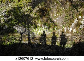 Stock Photo - shadows of three 
people and tree 
on rocks. fotosearch 
- search stock 
photos, pictures, 
images, and photo 
clipart