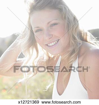 Stock Photograph - teenage girl (16-17) 
in meadow, portrait, 
close-up. fotosearch 
- search stock 
photos, pictures, 
images, and photo 
clipart