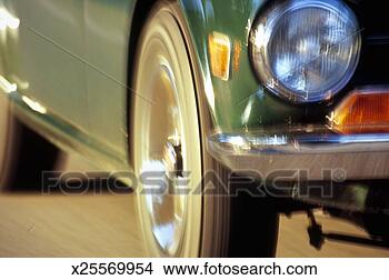 Stock Photo - vintage car speeding, 
close-up (blurred 
motion). fotosearch 
- search stock 
photos, pictures, 
images, and photo 
clipart