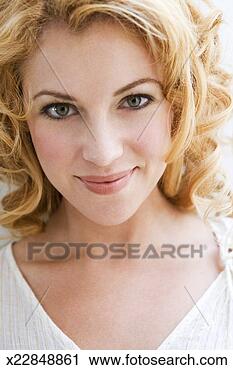Stock Photography - young woman smiling, 
portrait, close-up. 
fotosearch - search 
stock photos, 
pictures, images, 
and photo clipart