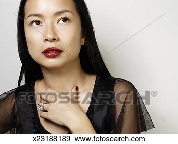 Stock Photograph - young woman wearing 
red lipstick and 
large diamond 
ring. fotosearch 
- search stock 
photos, pictures, 
images, and photo 
clipart