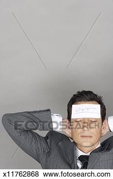 Stock Photo - business man with 
sticky note stuck 
on forehead,  
elevated view. 
fotosearch - search 
stock photos, 
pictures, images, 
and photo clipart
