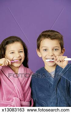 Stock Photo - girl (4-5 years) 
and boy (6-7 years) 
brushing teeth, 
 portrait. fotosearch 
- search stock 
photos, pictures, 
images, and photo 
clipart