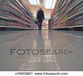 Stock Photography - person walking 
in supermarket, 
surface level 
(blurred motion). 
fotosearch - search 
stock photos, 
pictures, images, 
and photo clipart