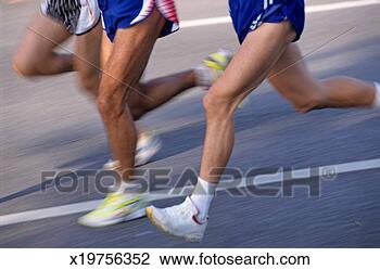 Stock Photo - three runners, 
low section (blurred 
motion). fotosearch 
- search stock 
photos, pictures, 
images, and photo 
clipart