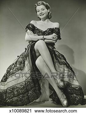Stock Photography - glamorous woman 
in evening gown 
showing legs, 
portrait, (b&w). 
fotosearch - search 
stock photos, 
pictures, images, 
and photo clipart