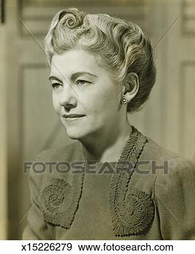 Stock Photograph - mid-adult woman 
indoors, (b&w). 
fotosearch - search 
stock photos, 
pictures, images, 
and photo clipart
