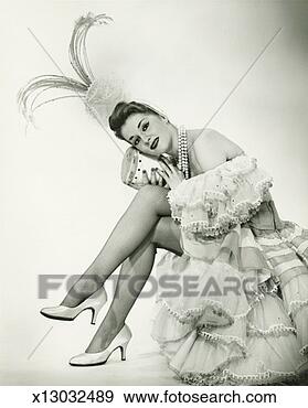 Stock Photograph - woman in latino 
dance costume 
sitting in studio, 
holding drum, 
(b&w). fotosearch 
- search stock 
photos, pictures, 
images, and photo 
clipart