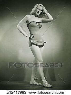 Stock Photo - woman in old fashioned 
one piece bathing 
suit posing in 
studio. fotosearch 
- search stock 
photos, pictures, 
images, and photo 
clipart