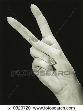 Stock Photography - woman showing 
peace sign (close-up 
of hand), (b&w), 
close-up. fotosearch 
- search stock 
photos, pictures, 
images, and photo 
clipart