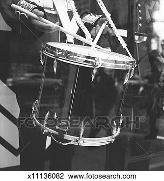 Stock Photo - military band 
drummer, reflection 
in window, (b&w), 
(mid section). 
fotosearch - search 
stock photos, 
pictures, images, 
and photo clipart