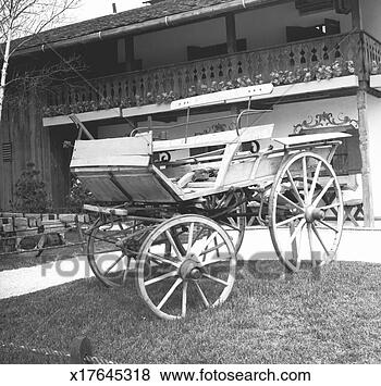 Stock Photo - old fashion carriage 
in front of house, 
(b&w). fotosearch 
- search stock 
photos, pictures, 
images, and photo 
clipart