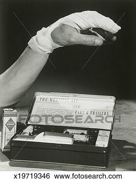 Stock Photo - bandaged arm next 
to first aid kit. 
fotosearch - search 
stock photos, 
pictures, images, 
and photo clipart