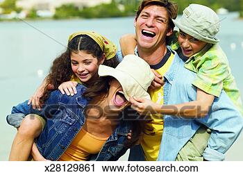 Stock Photography - mother and father 
carrying their 
son (11-12) and 
daughter (10-11) 
by. fotosearch 
- search stock 
photos, pictures, 
images, and photo 
clipart
