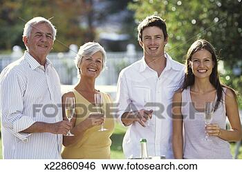 Stock Photo - young couple and 
mature couple 
holding champagne, 
portrait. fotosearch 
- search stock 
photos, pictures, 
images, and photo 
clipart