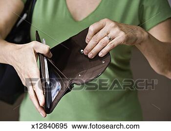 Stock Image - mature woman holding 
empty wallet, 
close up, mid 
section. fotosearch 
- search stock 
photos, pictures, 
images, and photo 
clipart