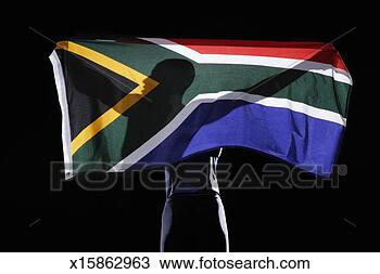Stock Photo - silhouette of 
person holding 
flag of south 
africa on black 
background. fotosearch 
- search stock 
photos, pictures, 
images, and photo 
clipart
