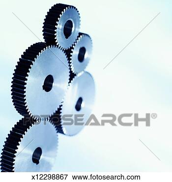 Picture - close-up of five 
cogs. fotosearch 
- search stock 
photos, pictures, 
images, and photo 
clipart